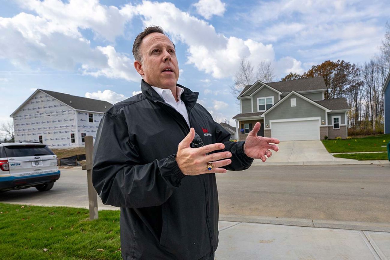 Steve Rupp in front of a home under construction 