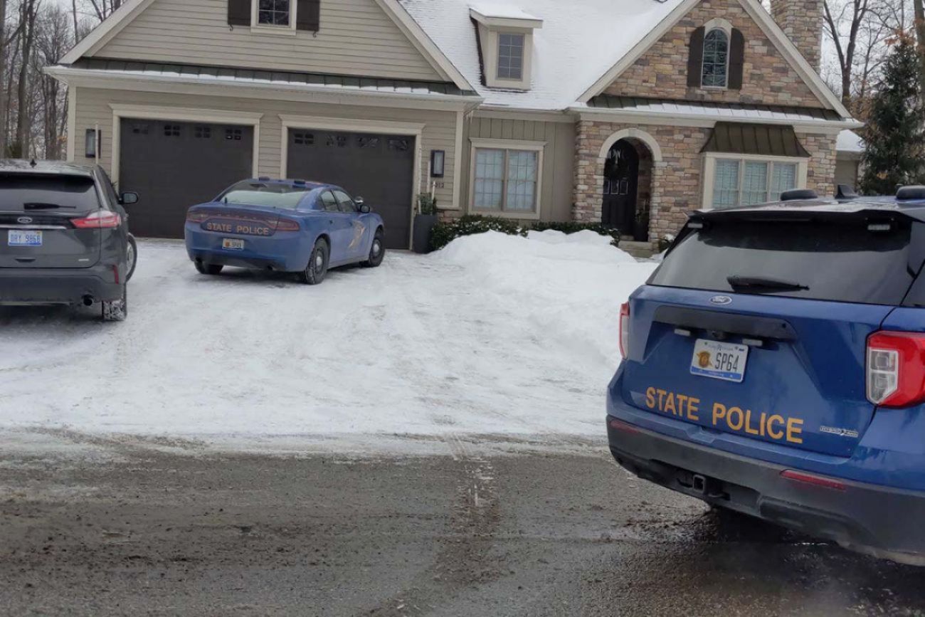 police cars in front of house