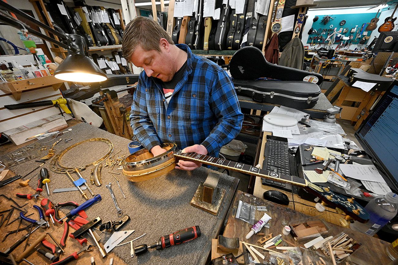 Jeffrey Renton repairing a banjo