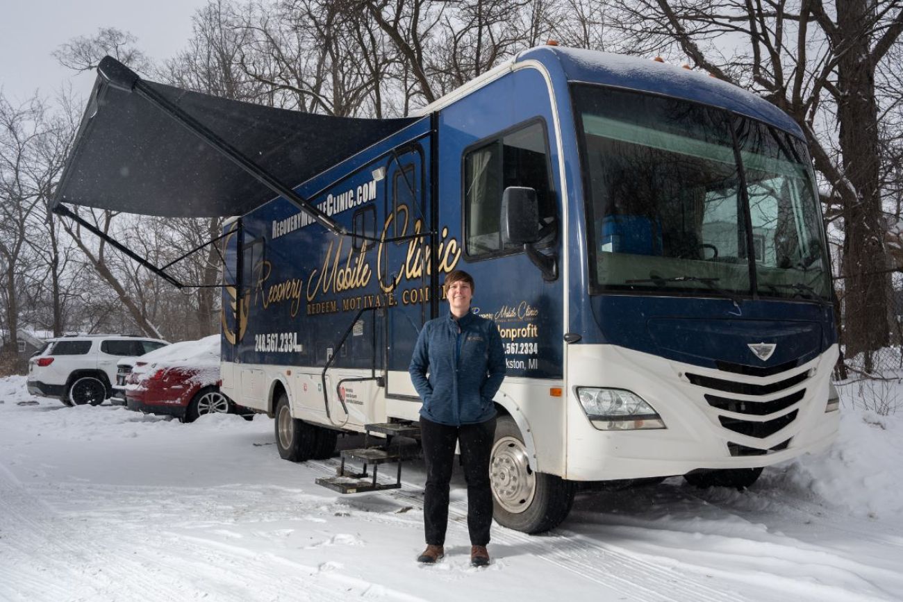 woman in front of RV