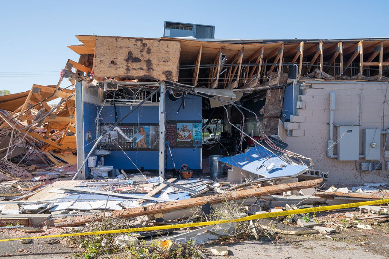 the back walls of a building are gone, you can see the blue inside wall