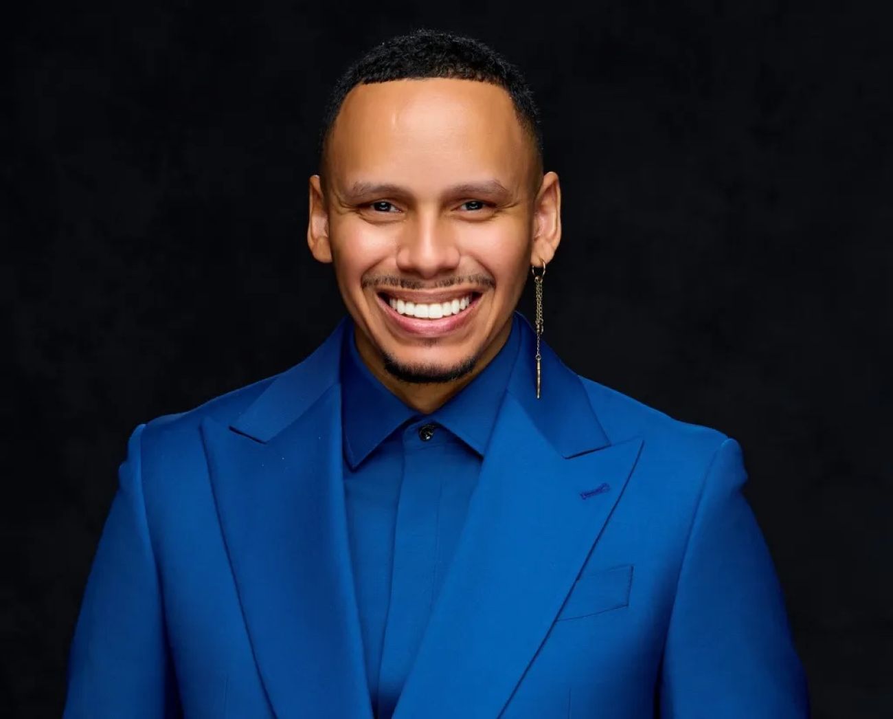 Kevin Heard is wearing a blue suit