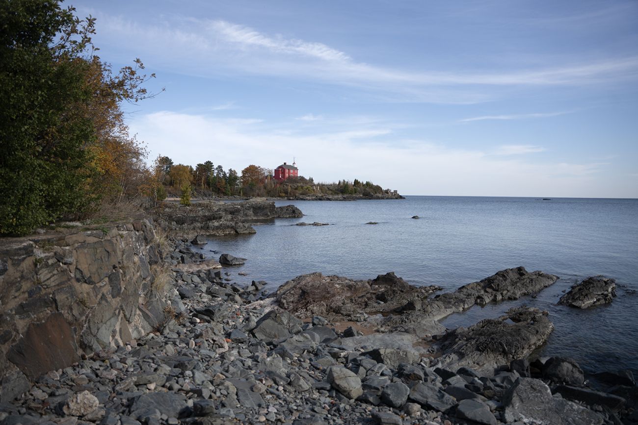 Some of the same rock formation in the cove just south of the Marquette Harbor Lighthouse can be seen in this present day photo