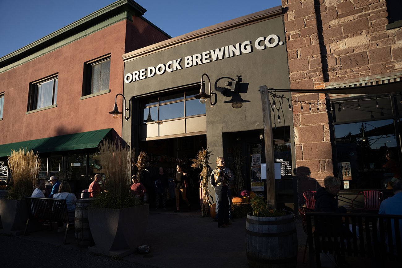 Outside view of Ore Docks Brewing Co. People are eating outside