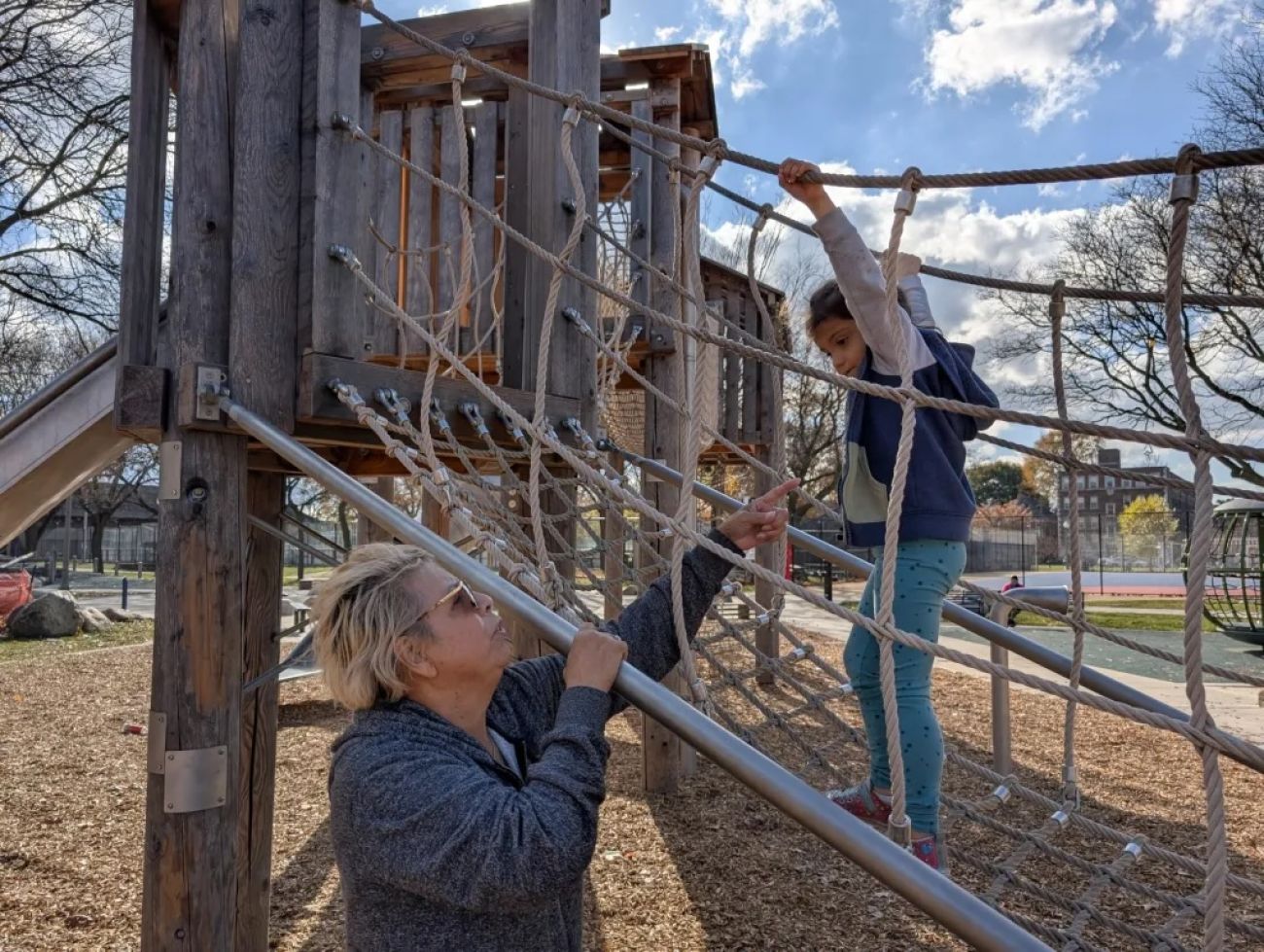 Anita Vargas on the playground with a small child