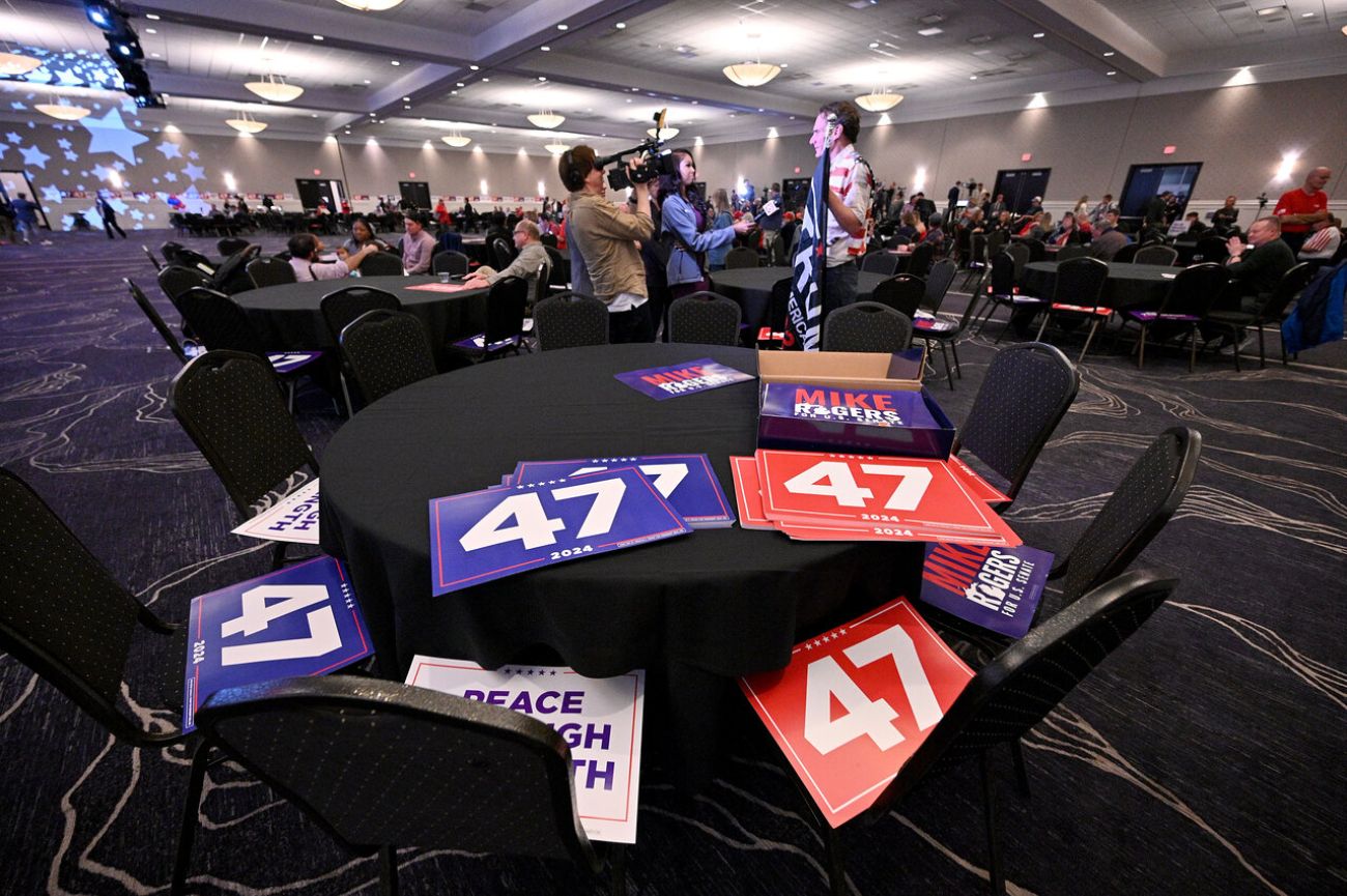 Campaign signs adorn a table