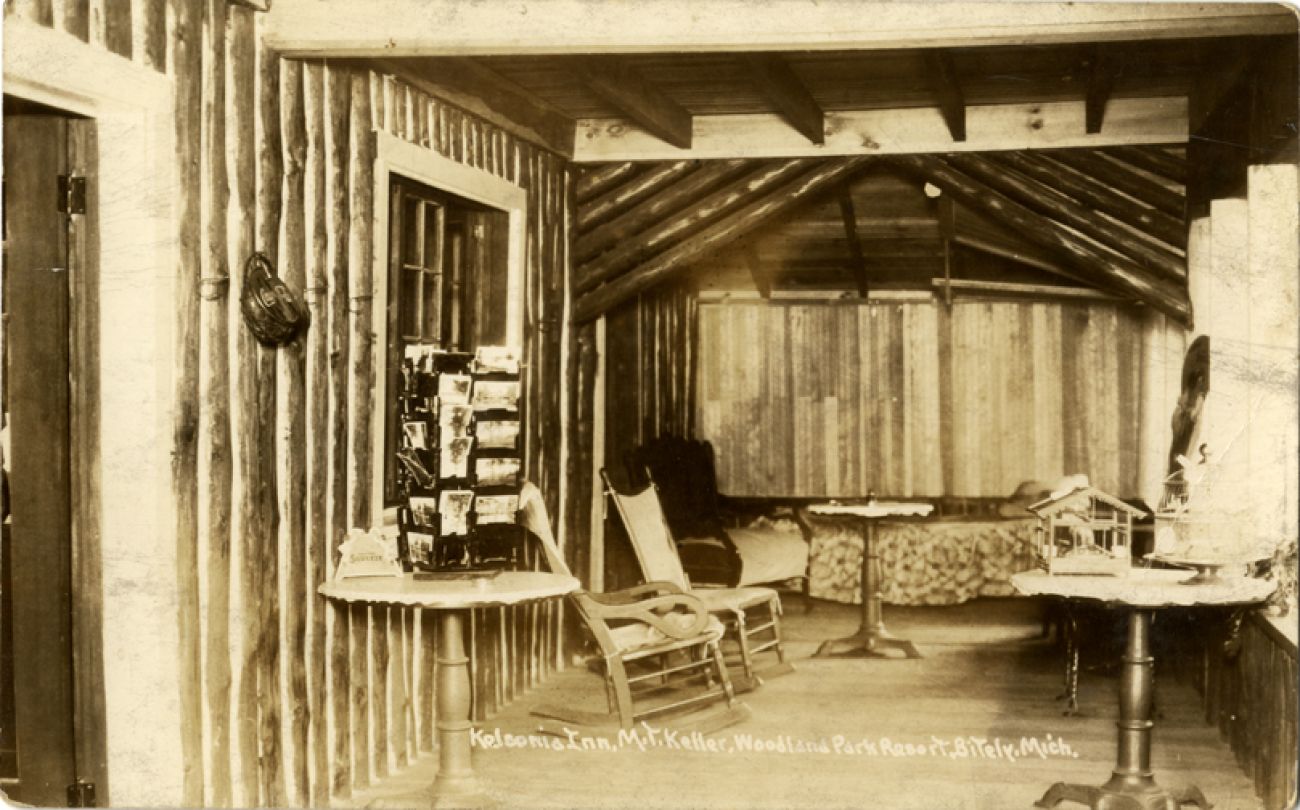 A historic postcard of the Kelsonia Inn. It looks like the inside of a cabin.