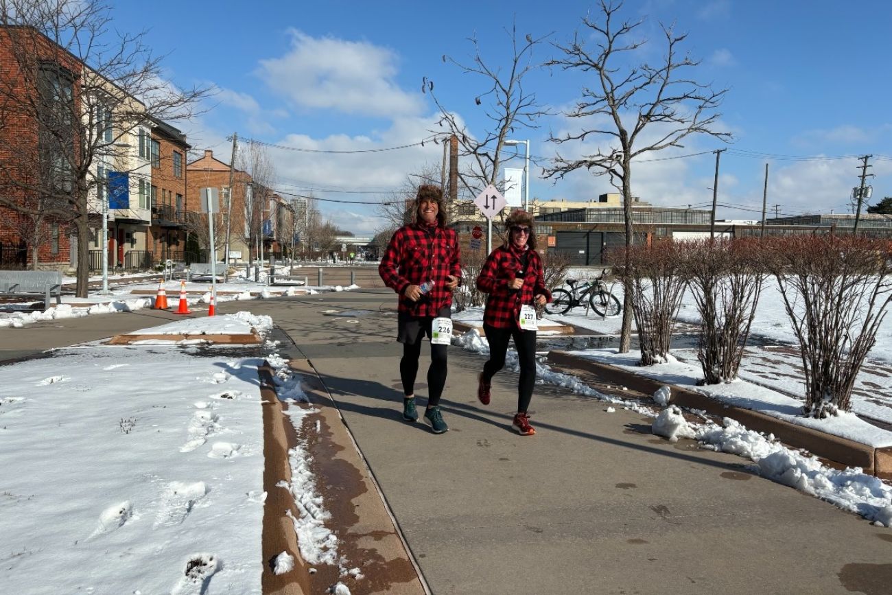 Runners dressed as lumberjacks compete in a race
