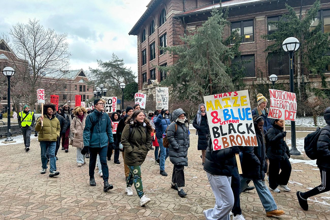 People marching on University of Michigan's campus.