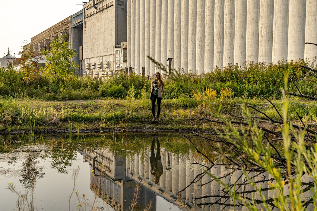 Jessie McFadden, wildlife biologist with the local conservation authority, stands by a pond.