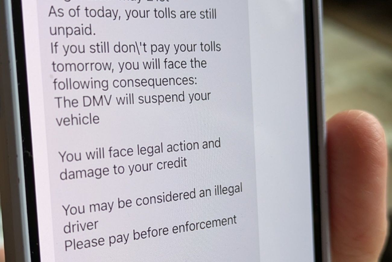 A scam text message is seen on a smartphone screen