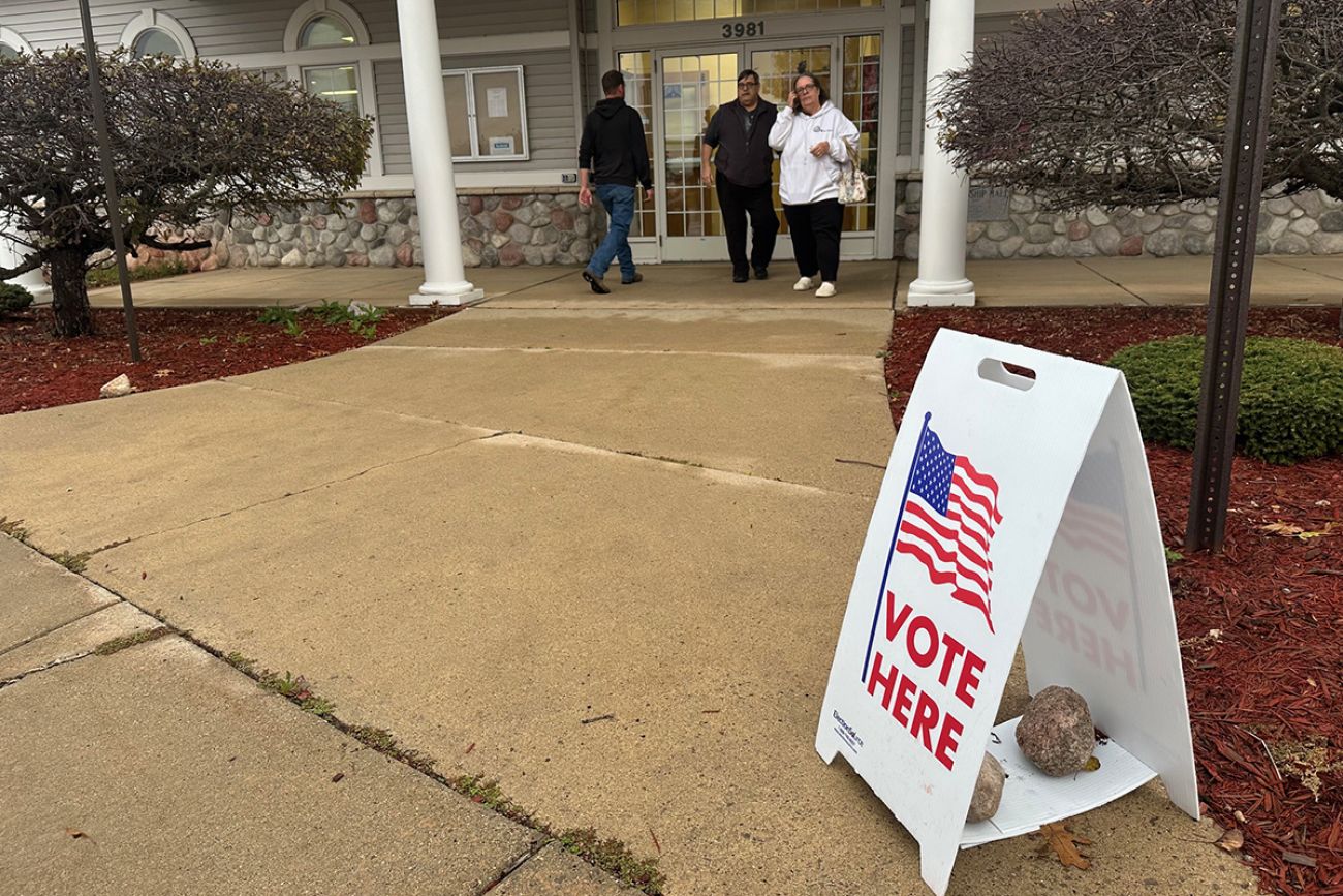 A sign that says "Vote Here."