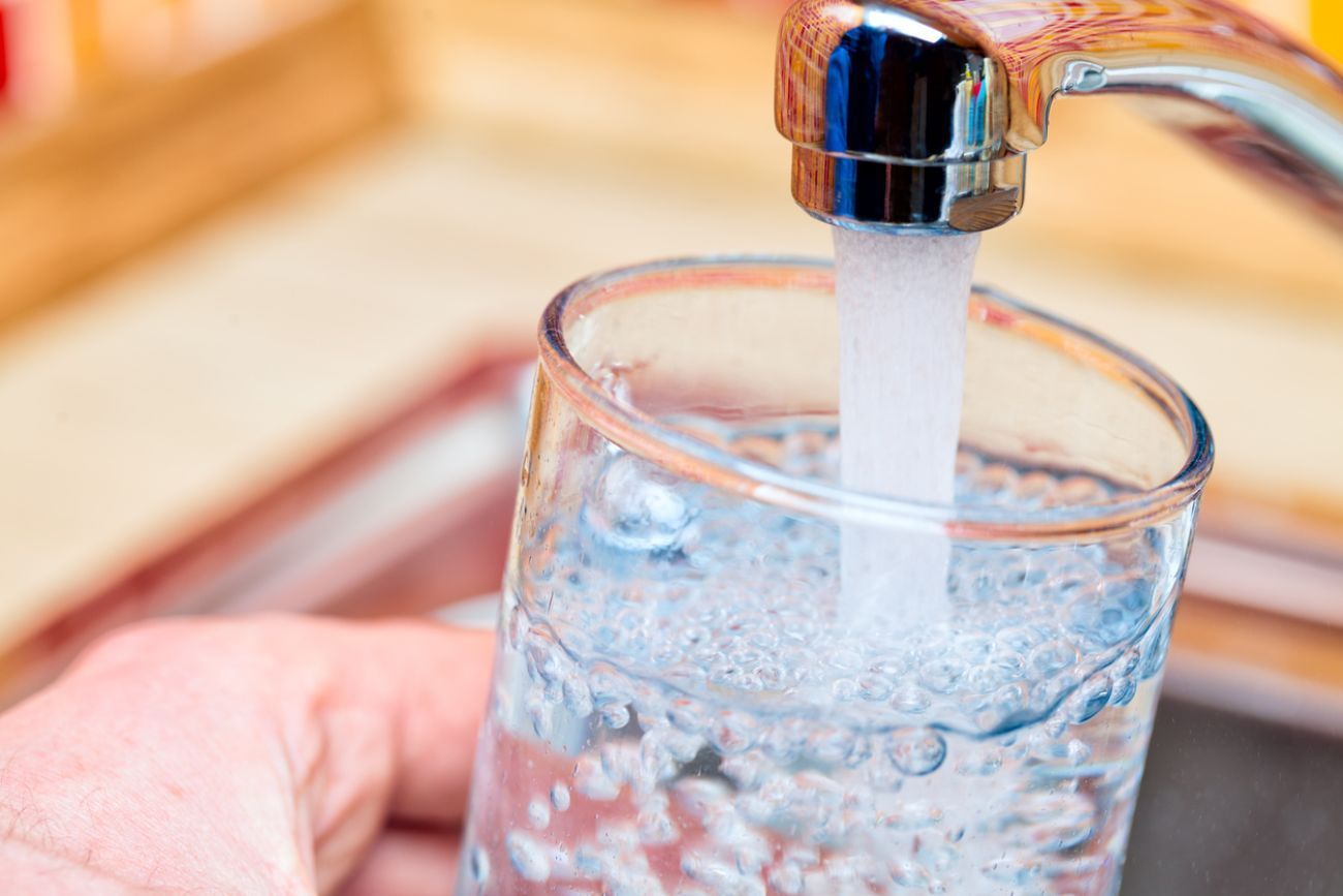 Water comes out of the sink.