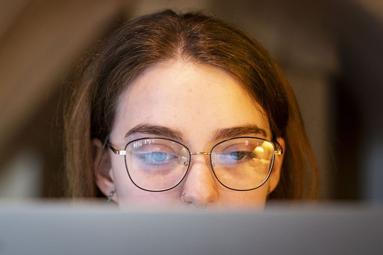 Piper Hartley looking at a computer.