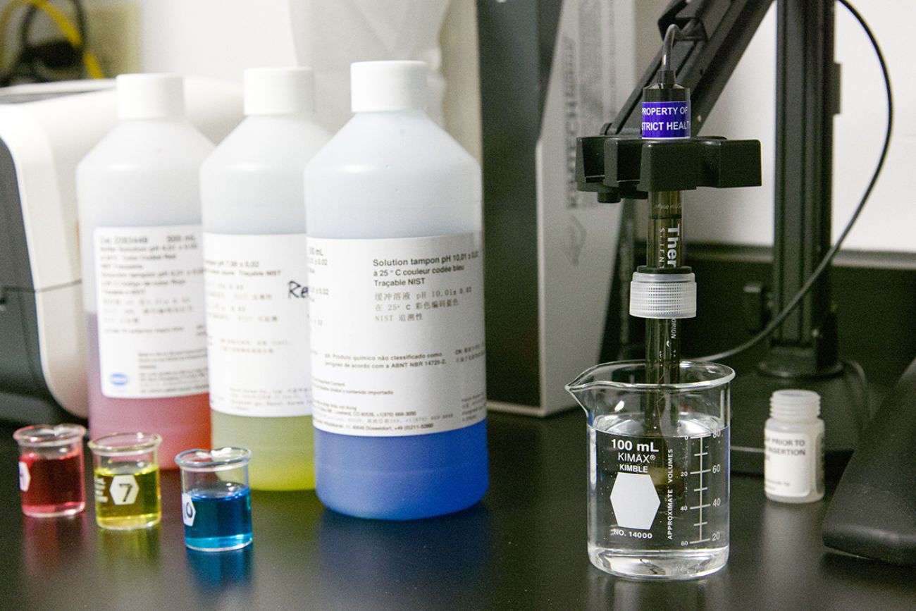 Chemicals and testing equipment in a lab.