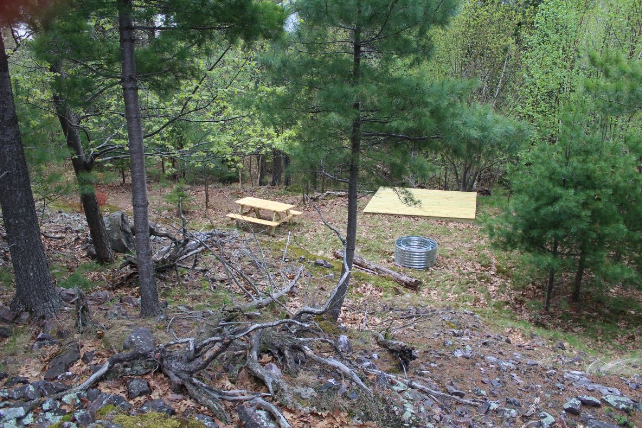 A campsite is seen in the middle of the northern Michigan woods