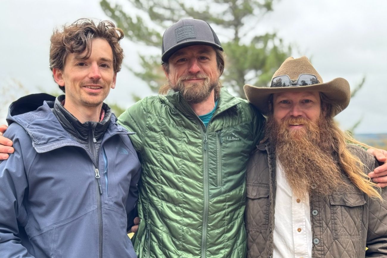 Three people pose for a photo