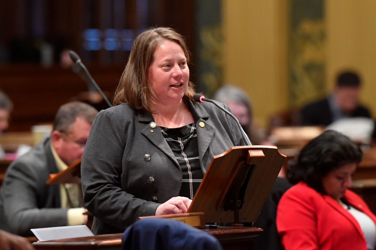 House Judiciary Chair and state Rep. Sarah Lightner, R-Springport, speaks at a podium.