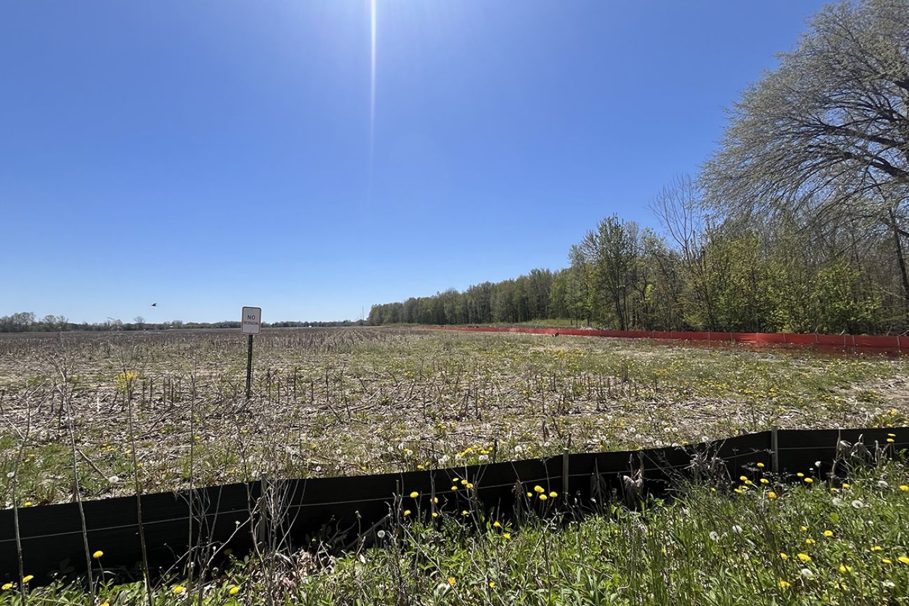 A temporary black fence and a ‘no trespassing’ sign in Mundy Township, Michigan.