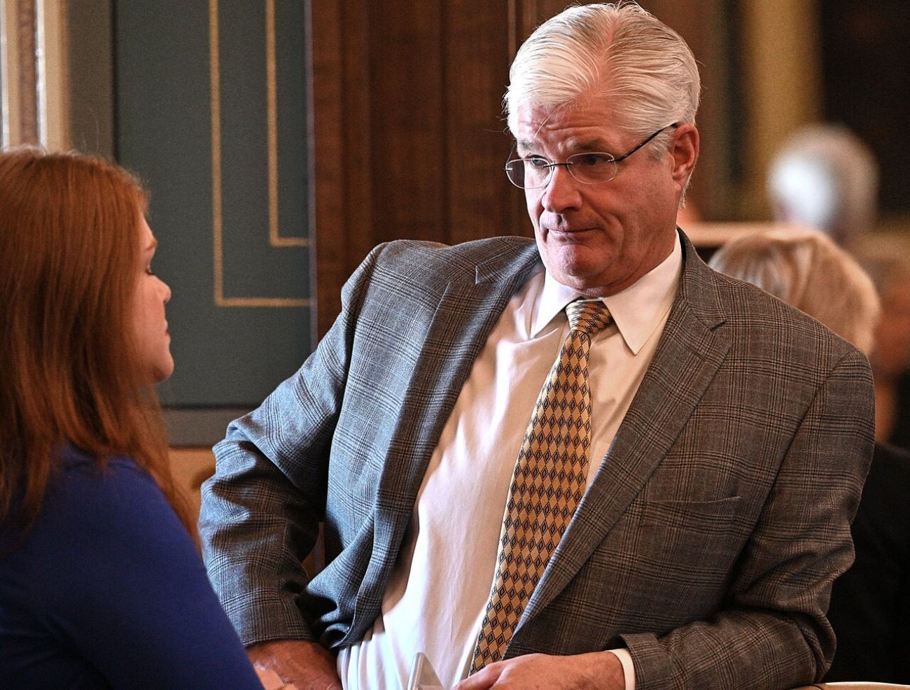 Former Senate Majority Leader Mike Shirkey talks to someone. 