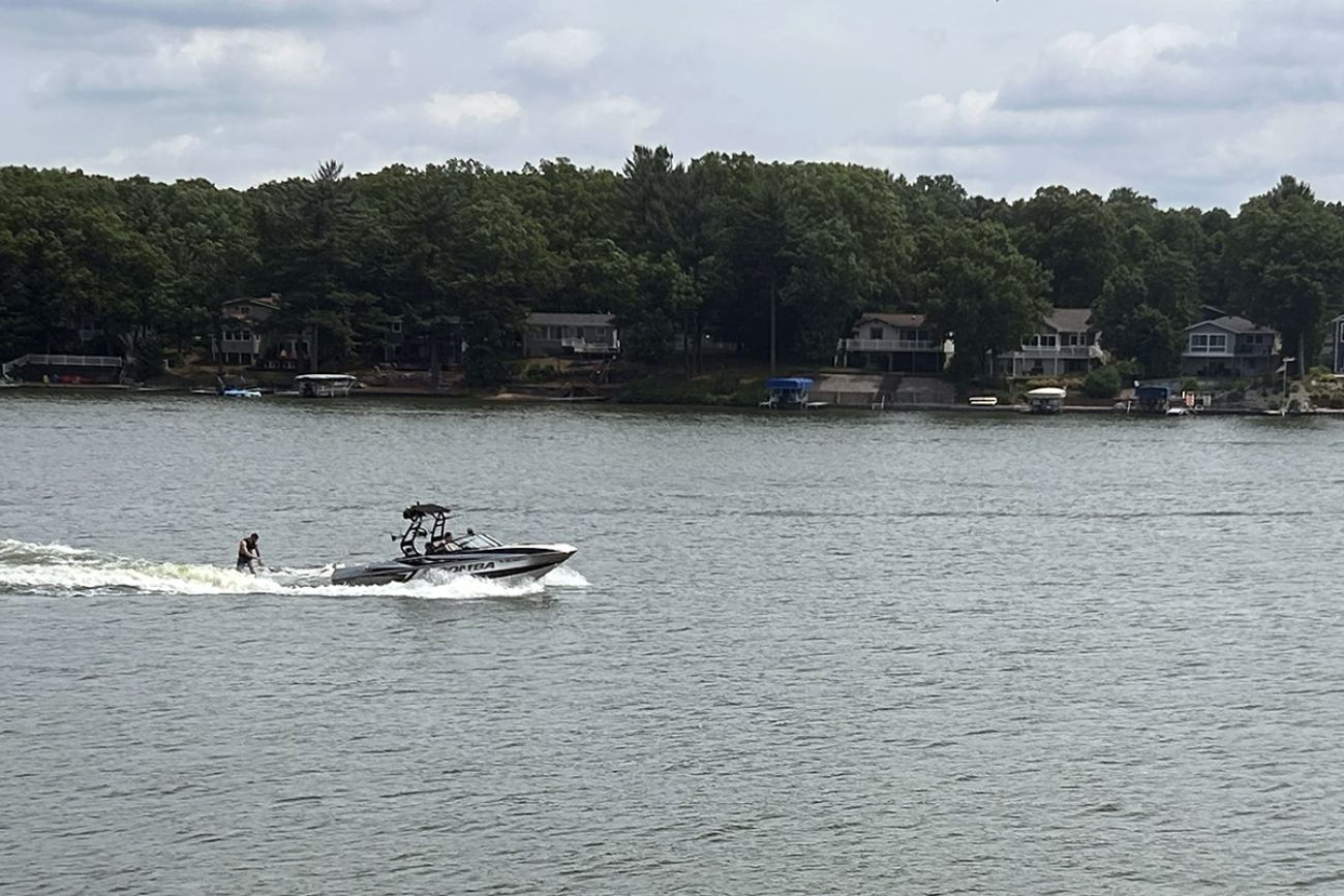 Wakeboarder goes across Brooks Lake in Michigan.