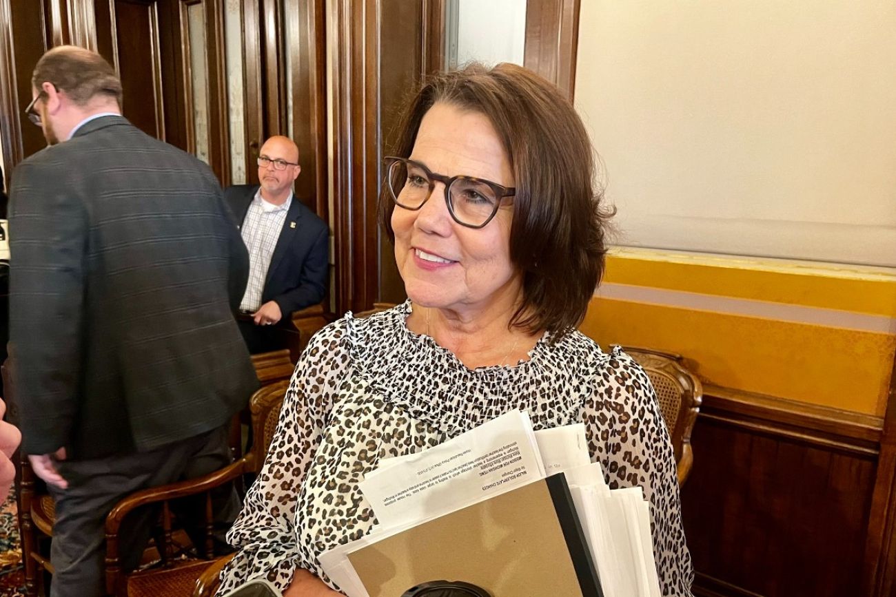 Woman holds papers