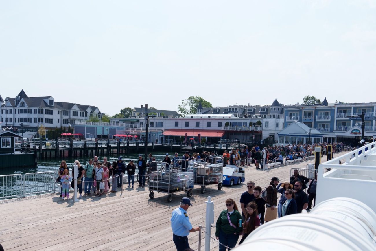 Tourist line up to board a ferry