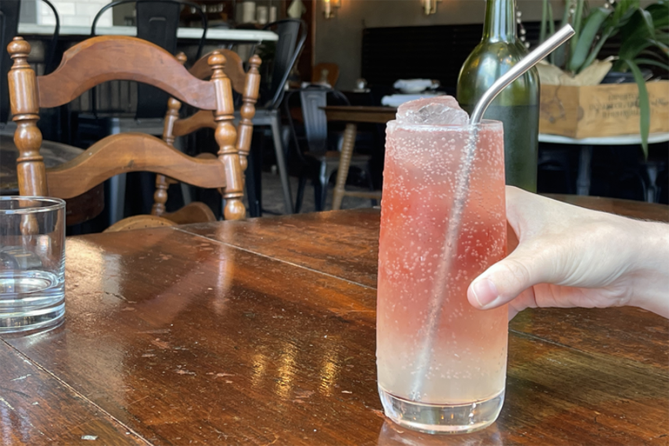 A pink mocktail on a table.