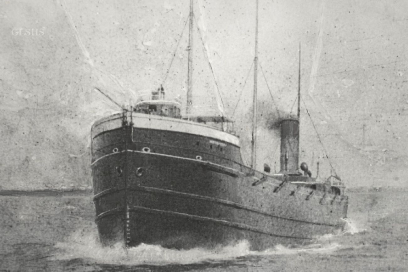 A black and white drawing of a sailing freighter
