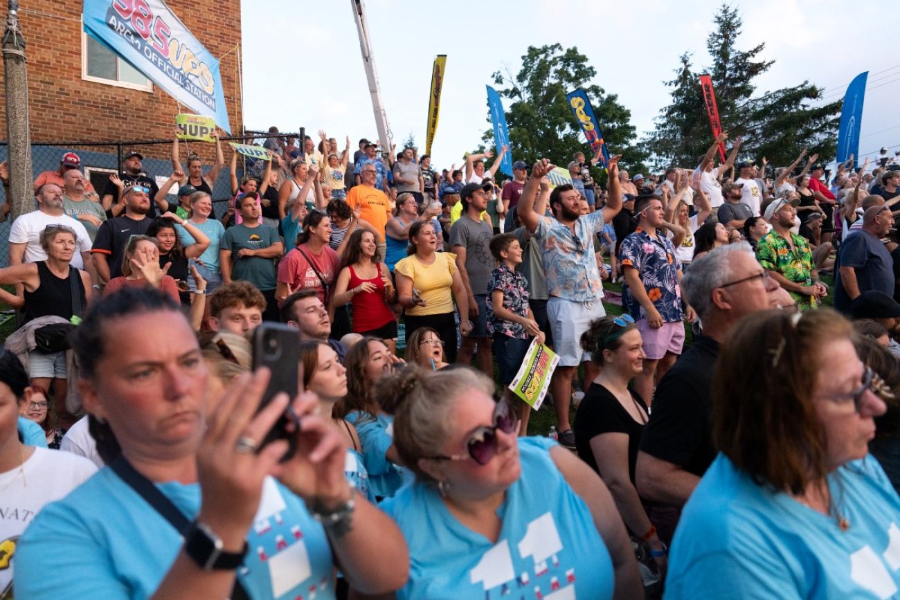 A crowd of spectators cheers