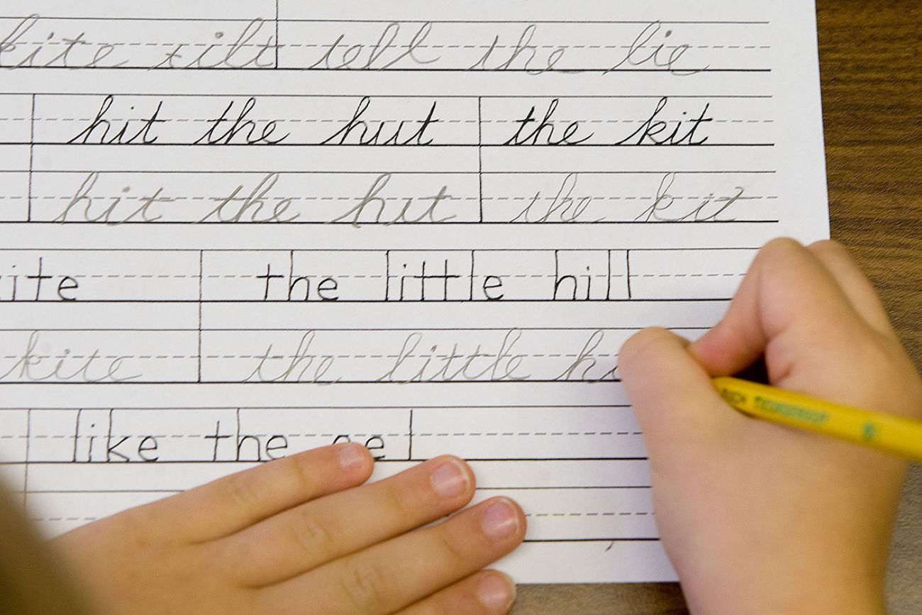 A child practicing cursive.