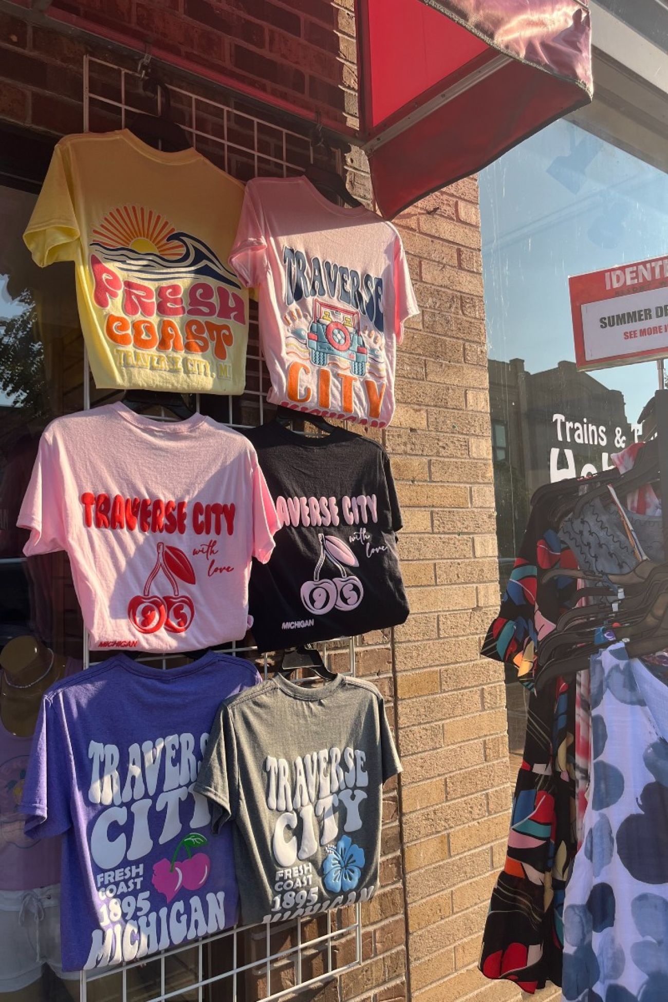 Shirts on a rack outside of a business