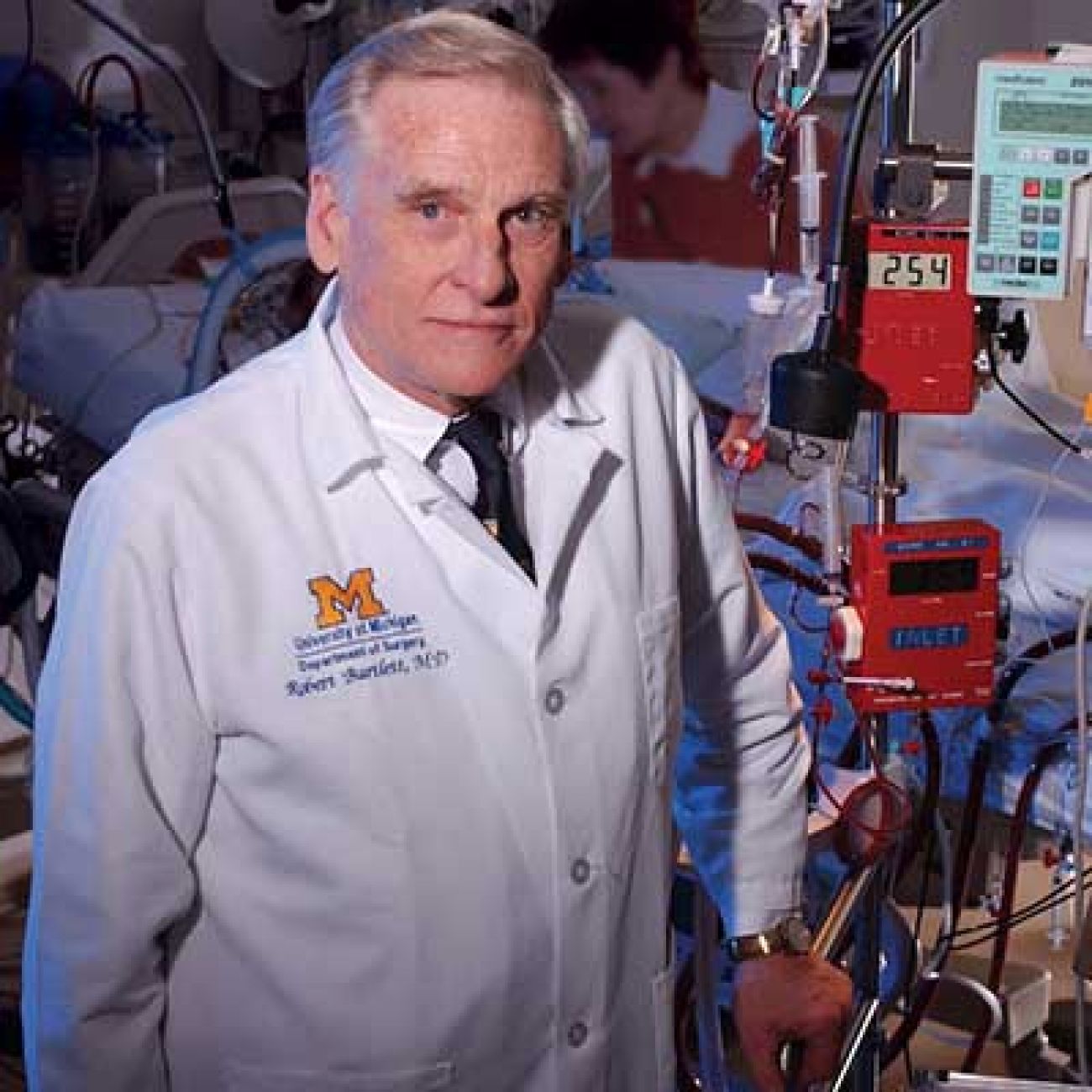 Dr. Robert Bartlett with medical technology behind him