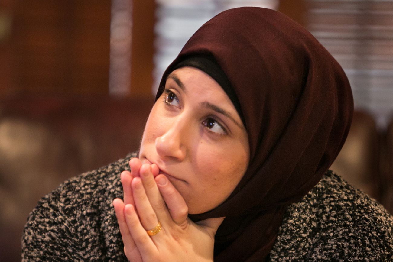 Mariam Charara watches the inauguration at her home in Dearborn