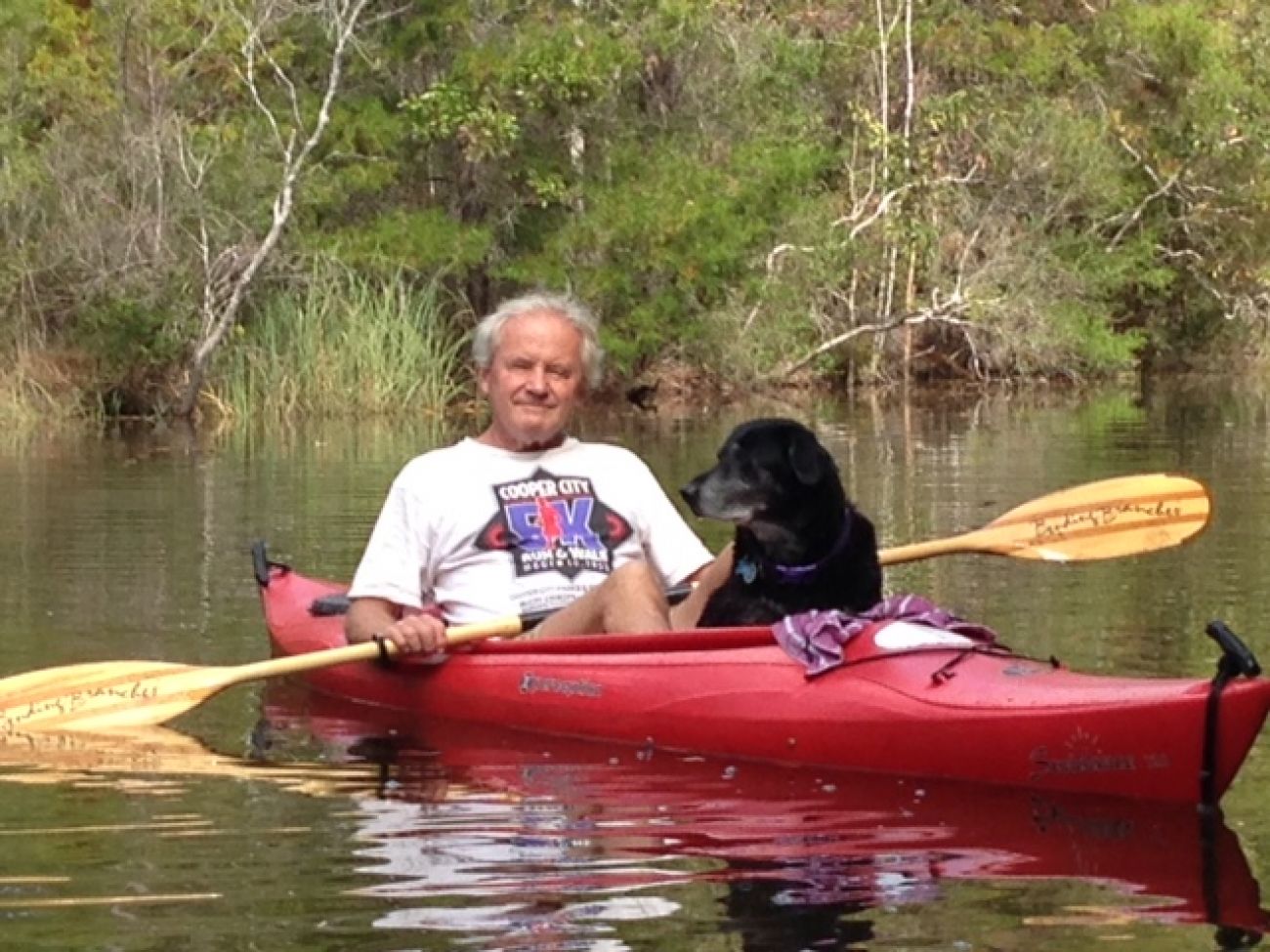 Tom Henderson and his dog, Maddie.