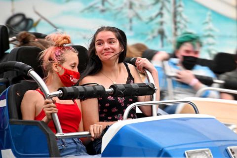 Teens react to a carnival ride at the Durand Railroad Days Festival.