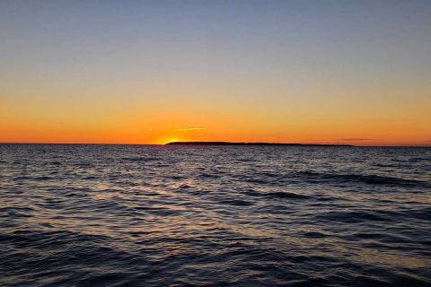 The sun sets over Lake Michigan