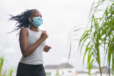 woman running in mask 