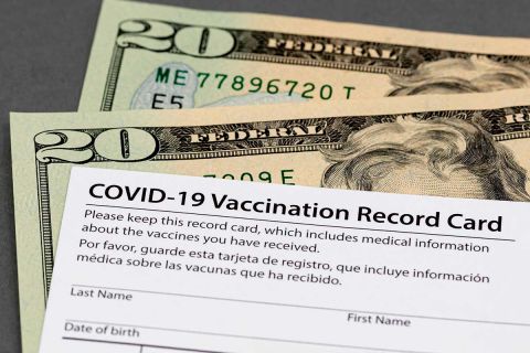 vaccine card and money