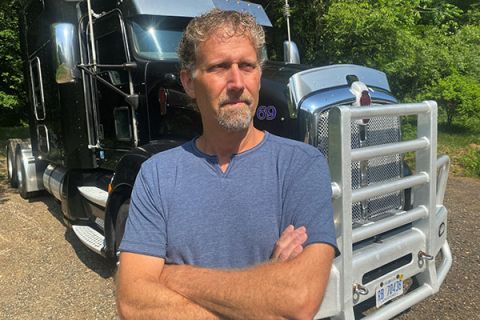 man in front oF a truck