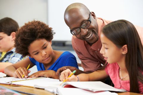 teacher working with students