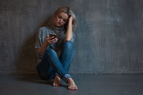 teen looking at phone