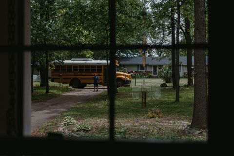 kid walking out of school bus