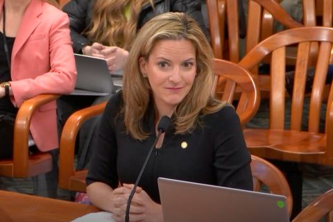 Secretary of State Jocelyn Benson sits at a desk