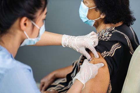 older woman getting a vaccine 
