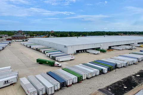 Trucks lined up outside building