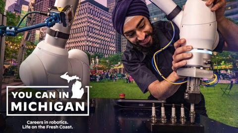"You can in Michigan" ad. You can see a man work on a robot