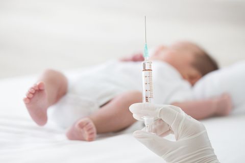 Syringe with blur baby background