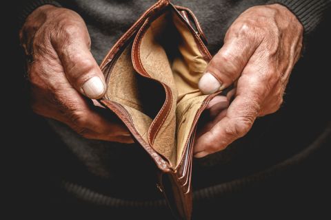 Man holding wallet empty