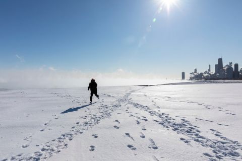 person walks on a frozen Lake Michigan